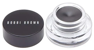 A close up image of Bobbi Brown Long Wear Gel Eyeliner in Black Ink showcasing the glass jar with the product and the black lid prominently displaying the brand name.