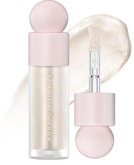 A bottle of Erinde Liquid Highlighter with a soft pink cap and wand applicator showcasing its shimmering texture in the background.