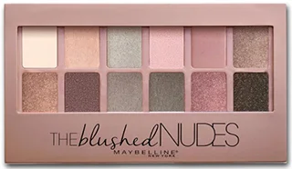 A close-up view of the Maybelline The Blushed Nudes Eyeshadow Palette, featuring a variety of twelve shades in soft pink, mauve, and neutral tones arranged in an elegant rectangular case with a transparent window.