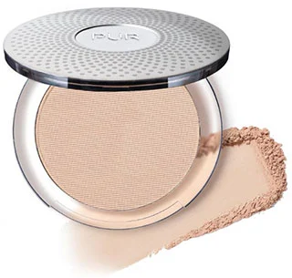 A compact of PÜR Beauty 4 in 1 Pressed Mineral Makeup with SPF 15 featuring foundation, concealer, and finishing powder, shown with some of the powder beside it.